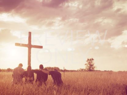 GROUP PRAYER KNEELING CROSS FIELD