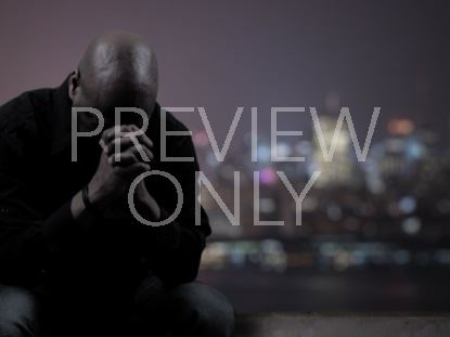 MAN PRAYING FOR CITY