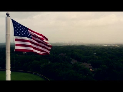 AMERICAN FLAG OVERLOOKING CITY