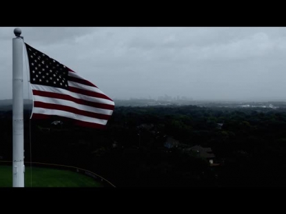 AMERICAN FLAG OVERLOOKING CITY CINEMATIC