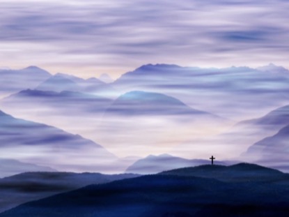 CROSS AND FOG IN THE MOUNTAINS